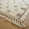 Détail de la bordure et des franges ivoire du tapis Beni Ouarain